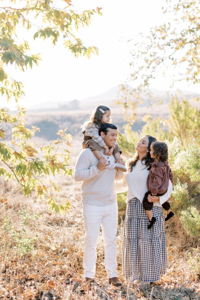 What to Wear for Family Photos (Family of 4 Outfit Ideas + Style Guide), family of four outfit ideas for outdoor photos, coordinated family photo outfits in neutral tones, what to wear for family photos with soft color palette, casual family outfits with denim and neutrals, fall family photo outfits with warm colors and layers, summer family photo outfits with light fabrics, cozy winter family outfits with textures, neutral outfit ideas for family photoshoot, family of four photoshoot outfit