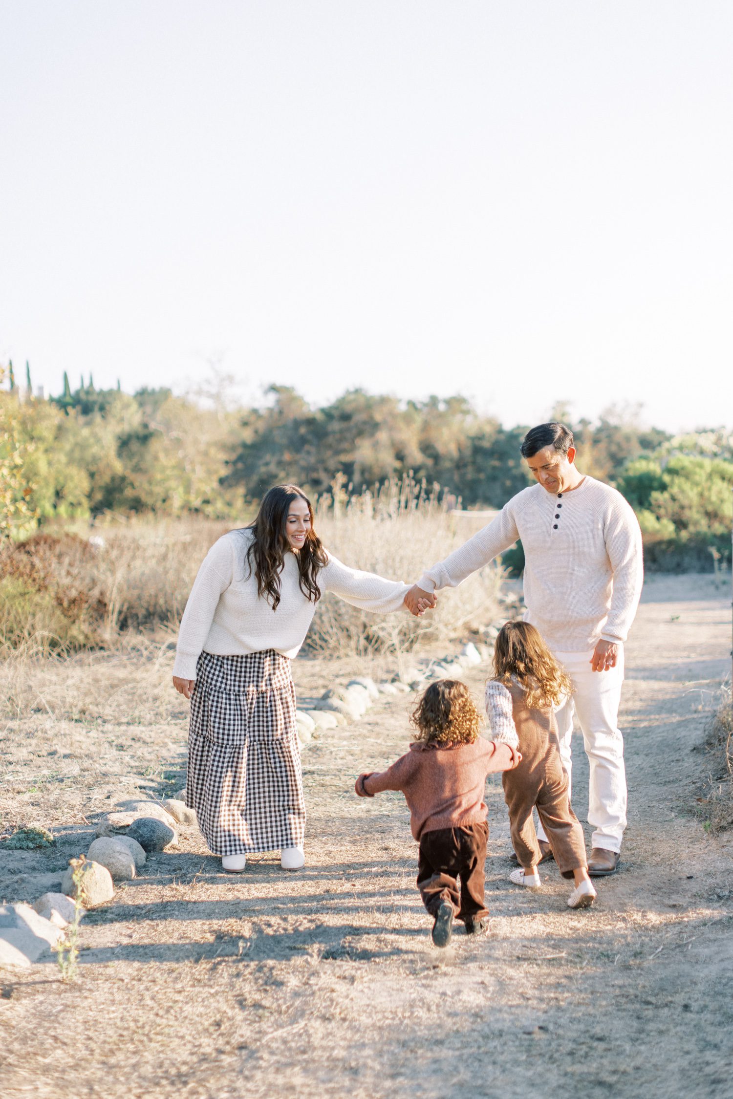 What to Wear for Family Photos (Family of 4 Outfit Ideas + Style Guide), family of four outfit ideas for outdoor photos, coordinated family photo outfits in neutral tones, what to wear for family photos with soft color palette, casual family outfits with denim and neutrals, fall family photo outfits with warm colors and layers, summer family photo outfits with light fabrics, cozy winter family outfits with textures, neutral outfit ideas for family photoshoot, family of four photoshoot outfit