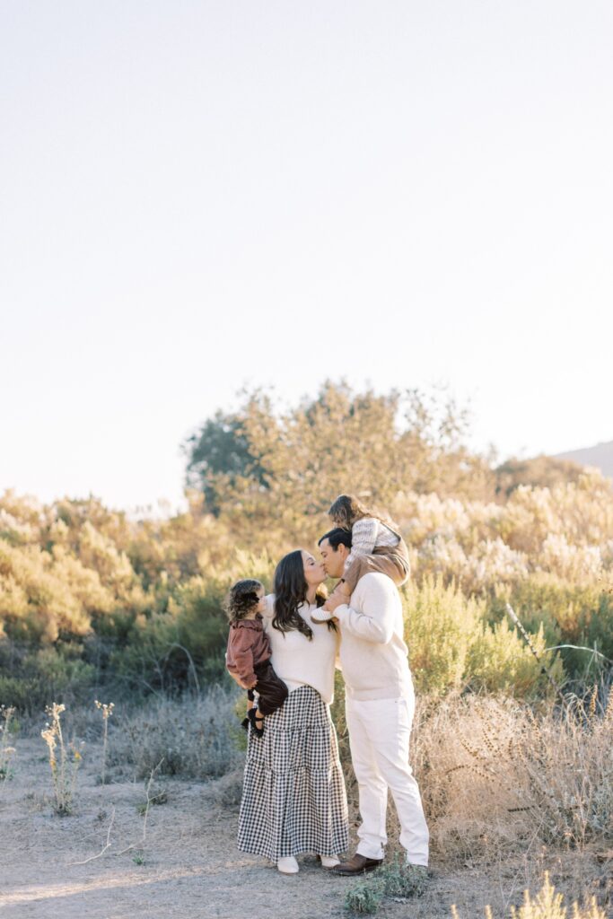 
What to Wear for Family Photos (Family of 4 Outfit Ideas + Style Guide), family of four outfit ideas for outdoor photos, coordinated family photo outfits in neutral tones, what to wear for family photos with soft color palette, casual family outfits with denim and neutrals, fall family photo outfits with warm colors and layers, summer family photo outfits with light fabrics, cozy winter family outfits with textures, neutral outfit ideas for family photoshoot, family of four photoshoot outfit 