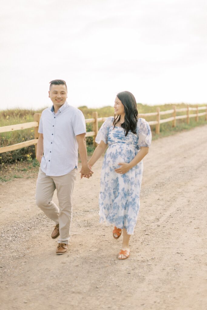Ventura County maternity photos at the beach during golden hour, pregnant mother in flowing neutral dress at Oxnard Beach Park, coastal maternity photography inspiration in Southern California, what to wear for maternity photos in Ventura County, luxury maternity session near Ojai and Ventura beaches, romantic pregnancy photos with soft natural light, California maternity photographer capturing emotional motherhood moments outdoors, ventura county maternity, ventura county maternity photographer