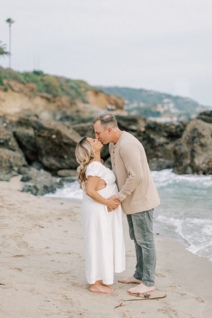 Ventura County maternity photos at the beach during golden hour, pregnant mother in flowing neutral dress at Oxnard Beach Park, coastal maternity photography inspiration in Southern California, what to wear for maternity photos in Ventura County, luxury maternity session near Ojai and Ventura beaches, romantic pregnancy photos with soft natural light, California maternity photographer capturing emotional motherhood moments outdoors, ventura county maternity, ventura county maternity photographer