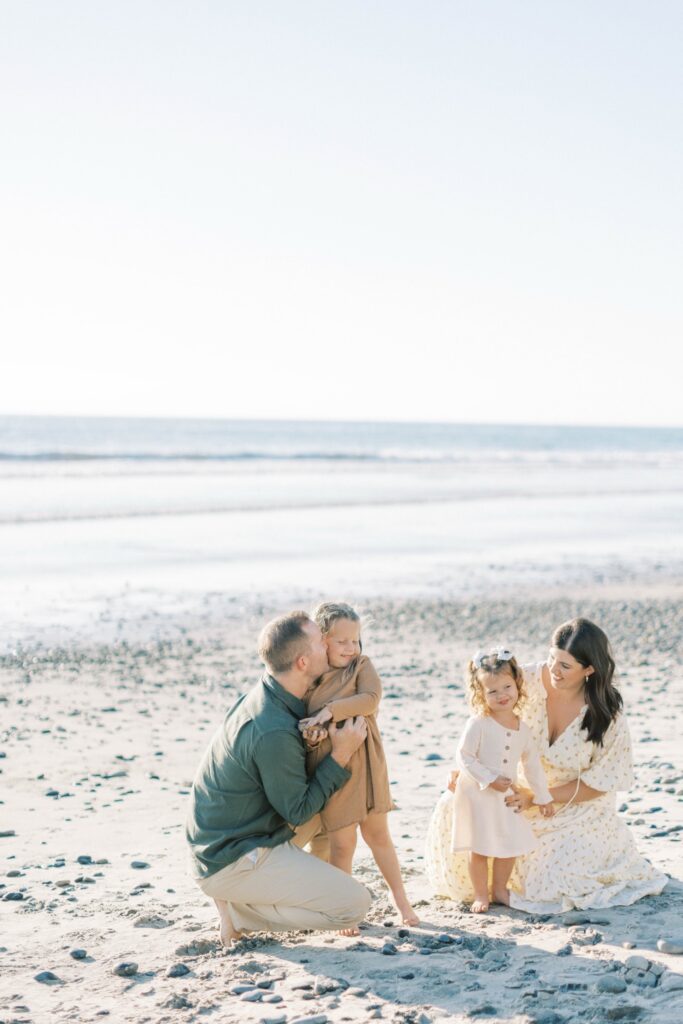 Family of four smiling together during fall family photos in Ventura County, holiday photos of kids together with christmas tree Los Angeles, candid shots of family fall photos, santa holiday mini sessions, holiday mini sessions ventura county, christmas tree family session in ventura county, fall beach photos of family together in Los Angeles, beach photos of kids in fall San Diego, fall beach photos of family together in Orange County, holiday mini session photos in Los Angeles