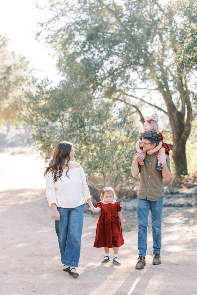 Family of four smiling together during fall family photos in Orange County, holiday photos of kids together with christmas tree Thousand Oaks, candid shots of family fall photos, Moorpark fall family photos at the beach, fall candid mini sessions ventura county, Los Angeles children with santa photos, fall beach photos of family together in Los Angeles, Orange County candid family of four photos, gingerbread making holiday photos in Thousand Oaks, holiday mini session photos in Los Angeles