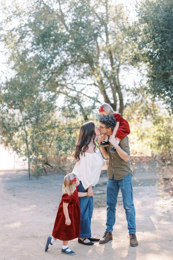 Family of four smiling together during fall family photos in Orange County, holiday photos of kids together with christmas tree Thousand Oaks, candid shots of family fall photos, Moorpark fall family photos at the beach, fall candid mini sessions ventura county, Los Angeles children with santa photos, fall beach photos of family together in Los Angeles, Orange County candid family of four photos, gingerbread making holiday photos in Thousand Oaks, holiday mini session photos in Los Angeles