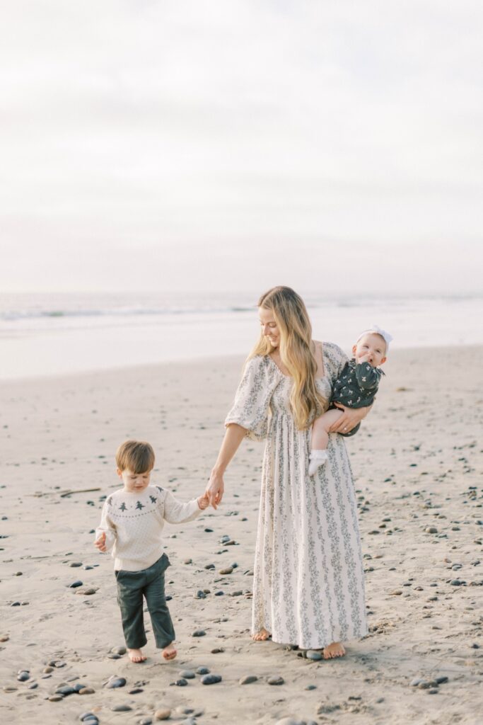 Family of four smiling together during fall family photos in Ventura County, family group shot in ventura county for fall family photos, candid shots of family fall photos, santa holiday mini sessions, holiday mini sessions ventura county, christmas tree family session in ventura county, fall beach photos of family together in ventura county, fall beach photos of family together in San Diego, fall beach photos of family together in Orange County, holiday mini session photos in Los Angeles